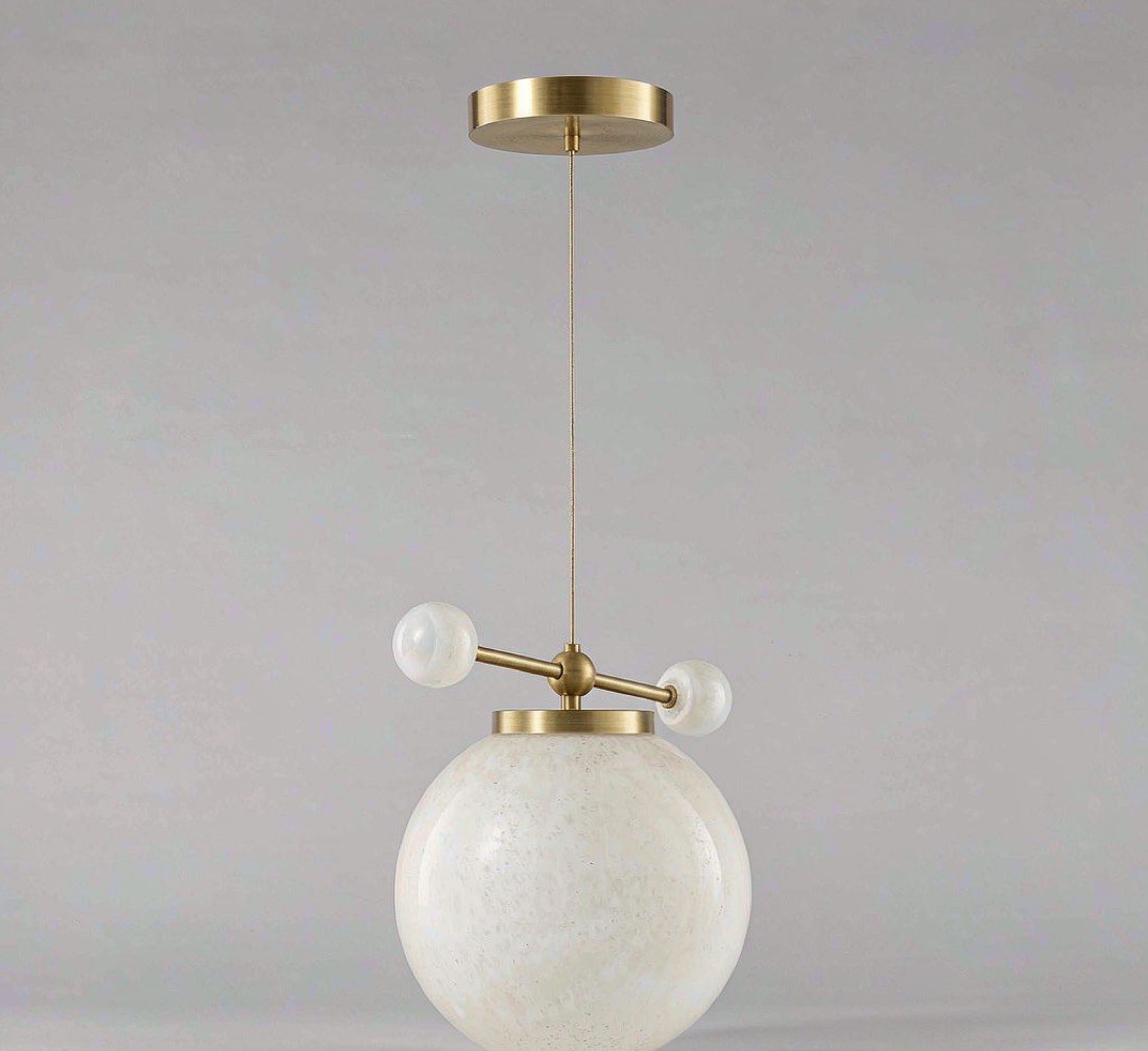 Aurora brushed brass pendant light with opal glass sphere