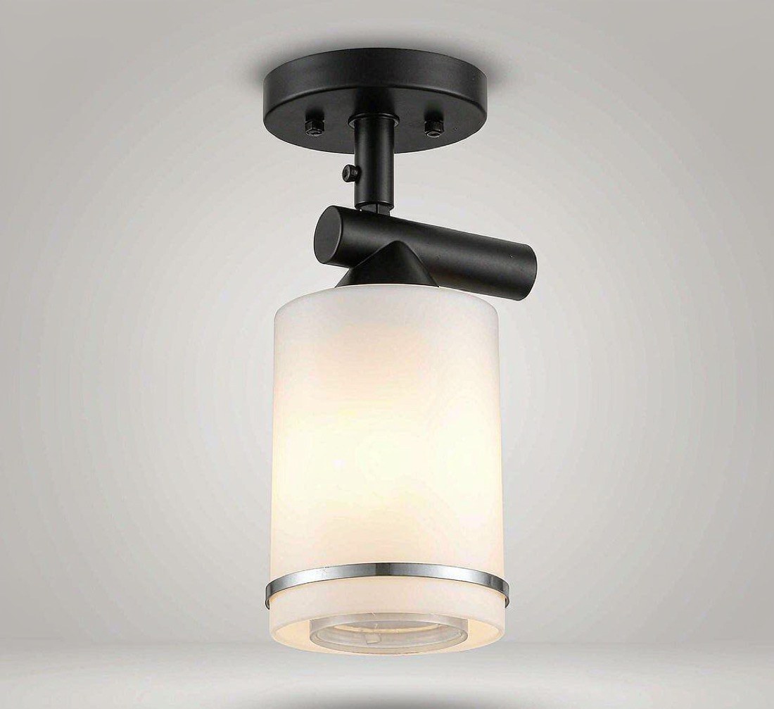 Nova matte black wall sconce with frosted glass cylinder
